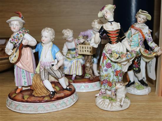 A pair of Continental porcelain groups of children, and a lady and gallante, 14cm and 16cm